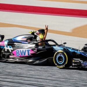 A person in a racing car on the track